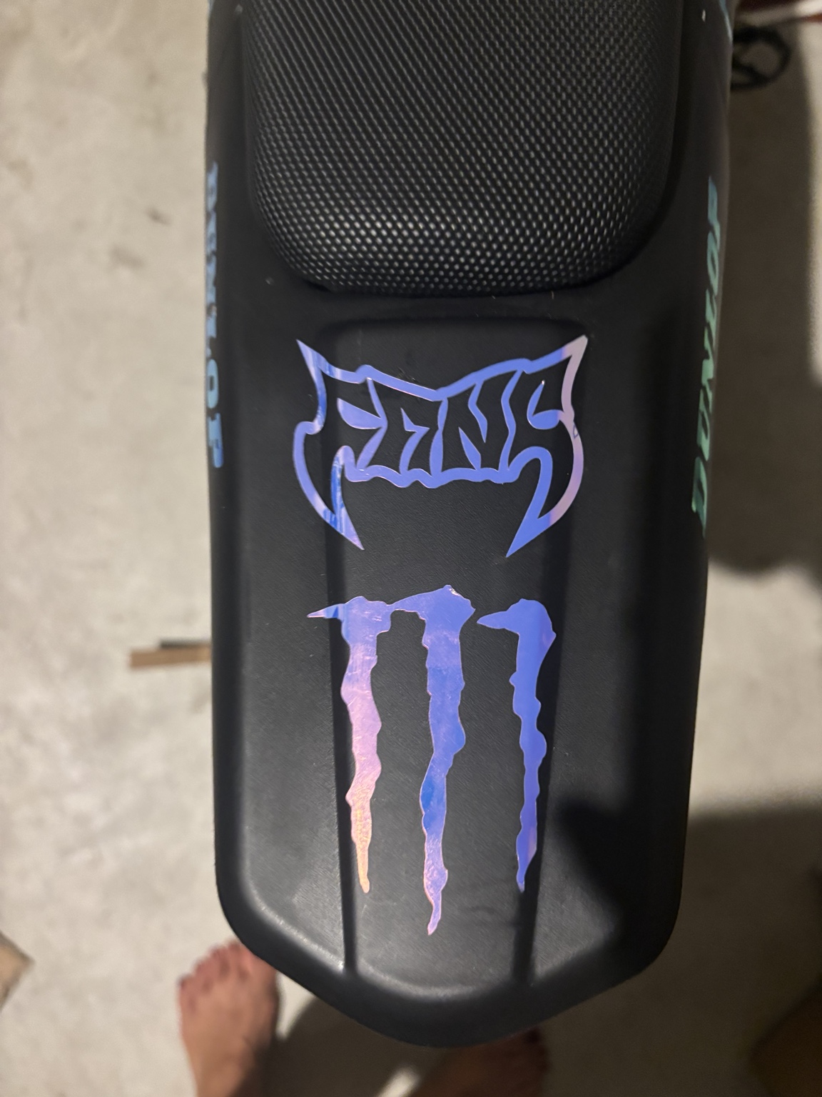 Holographic purple and blue graphics on the Cemoto’s rear fender